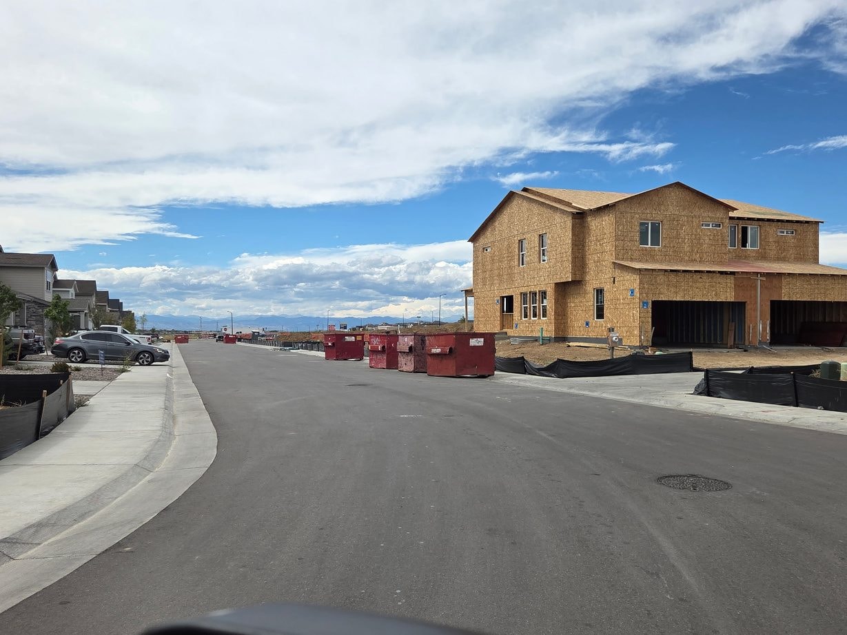 New home construction framing on a suburban street